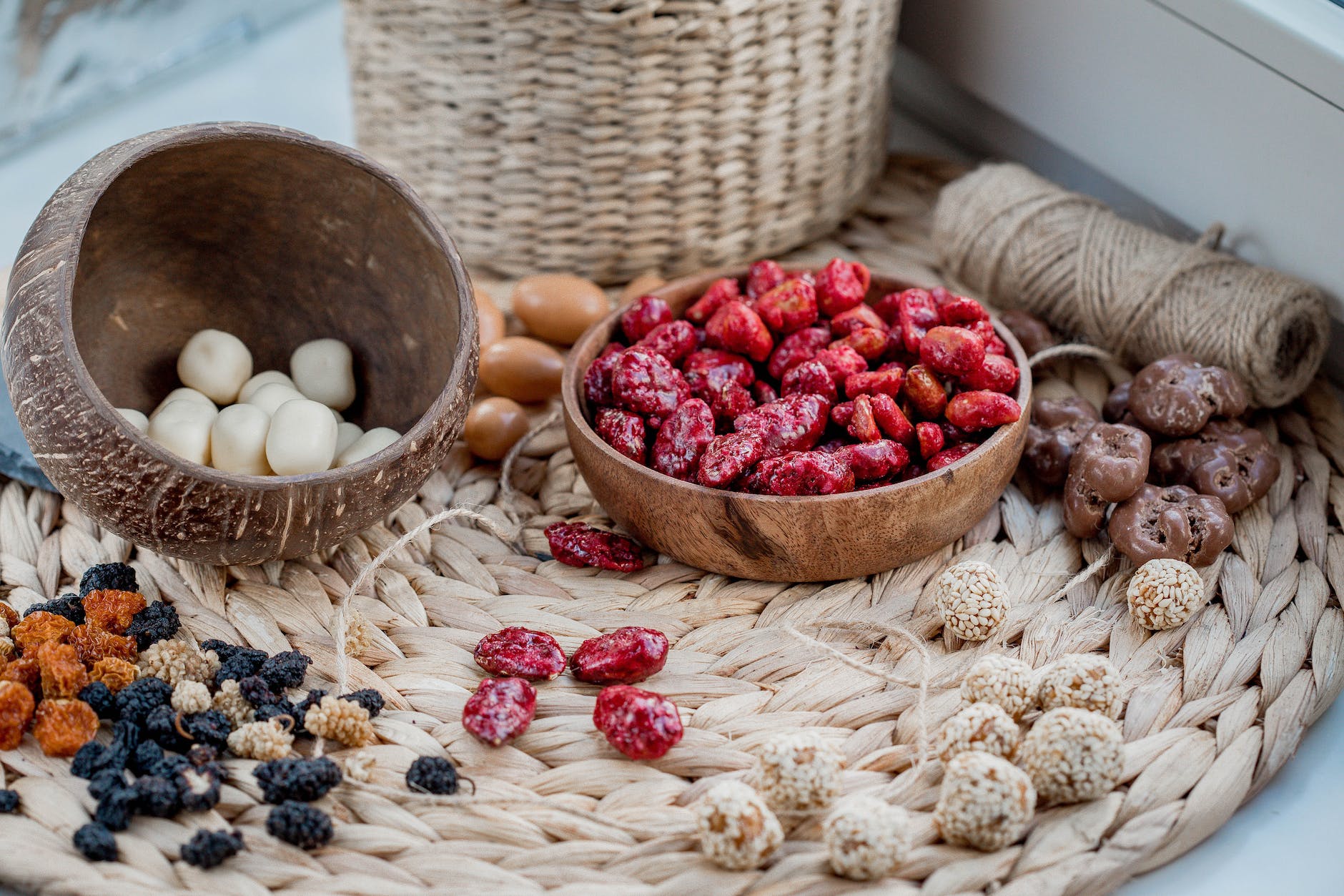 acai berries with selection of dried fruits in bowl on braided placemat