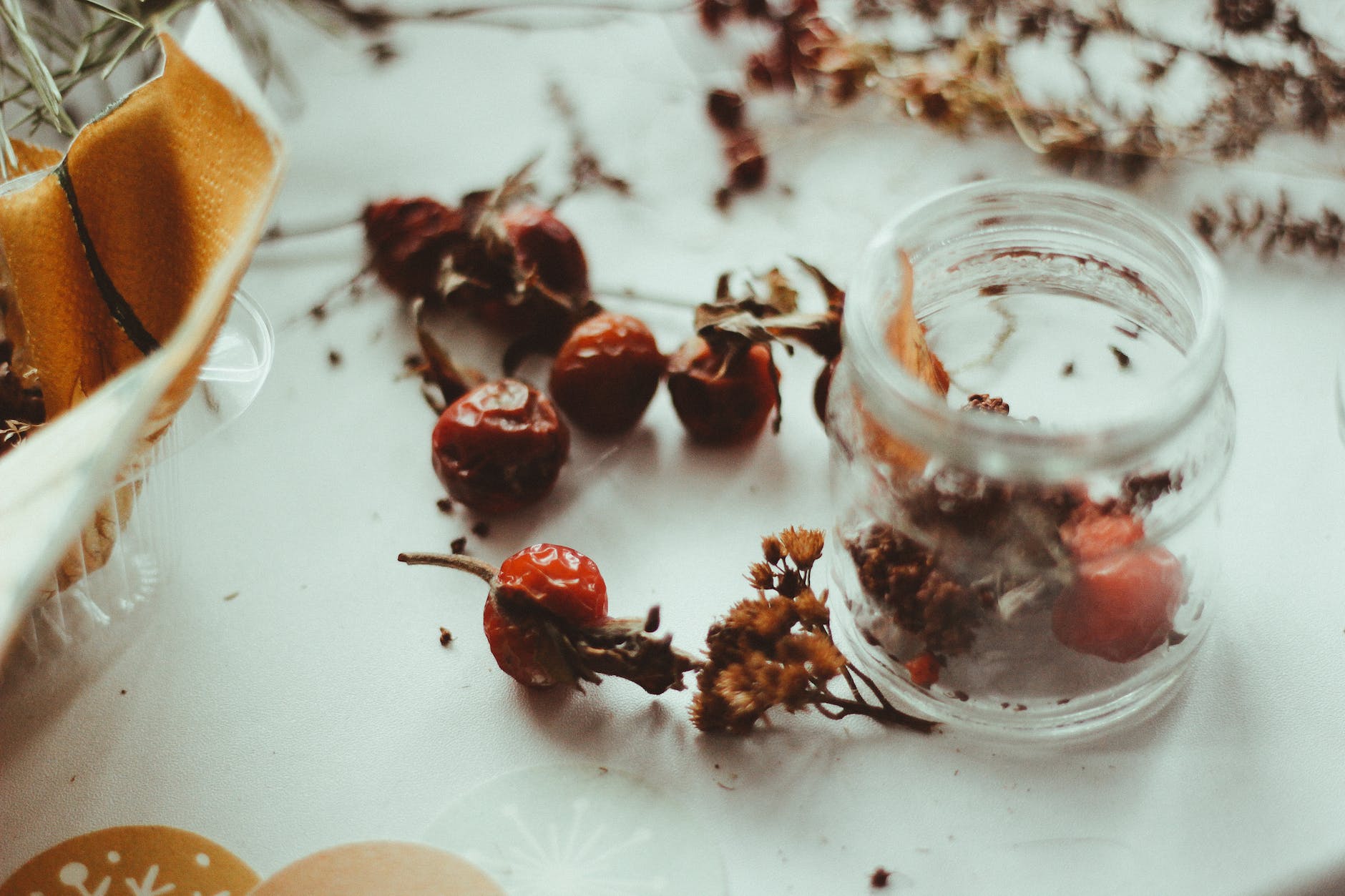 red fruits on white surface