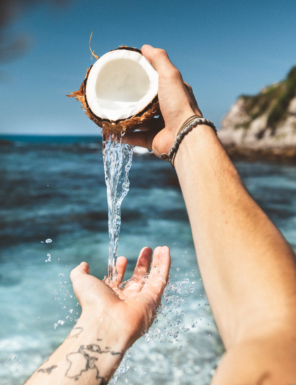 person pouring liquid on their hand