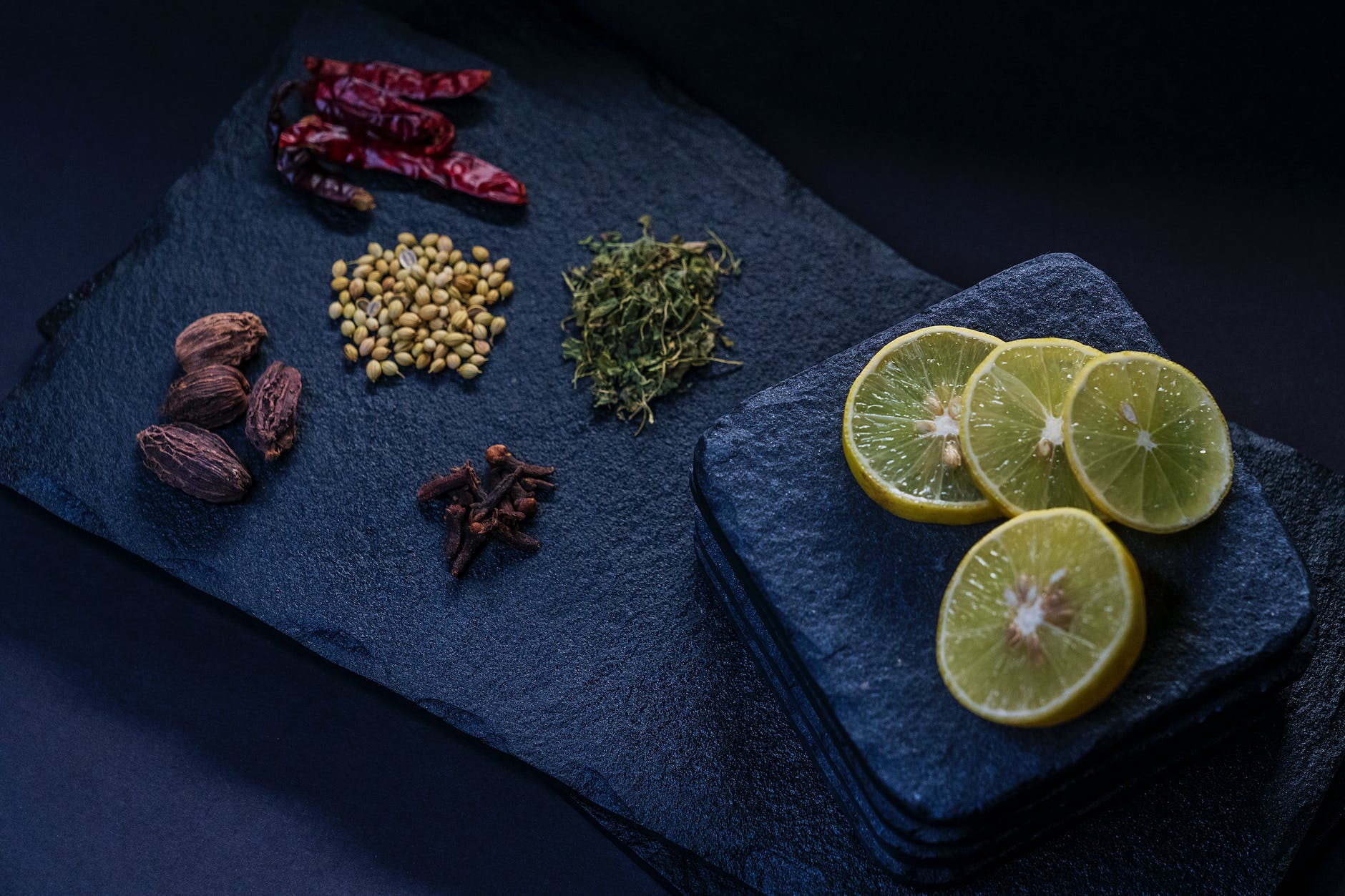 assorted dry condiments and fresh lemon slices