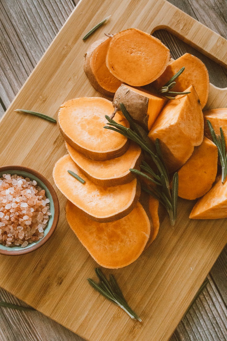 photograph of chopped sweet potatoes on a chopping board