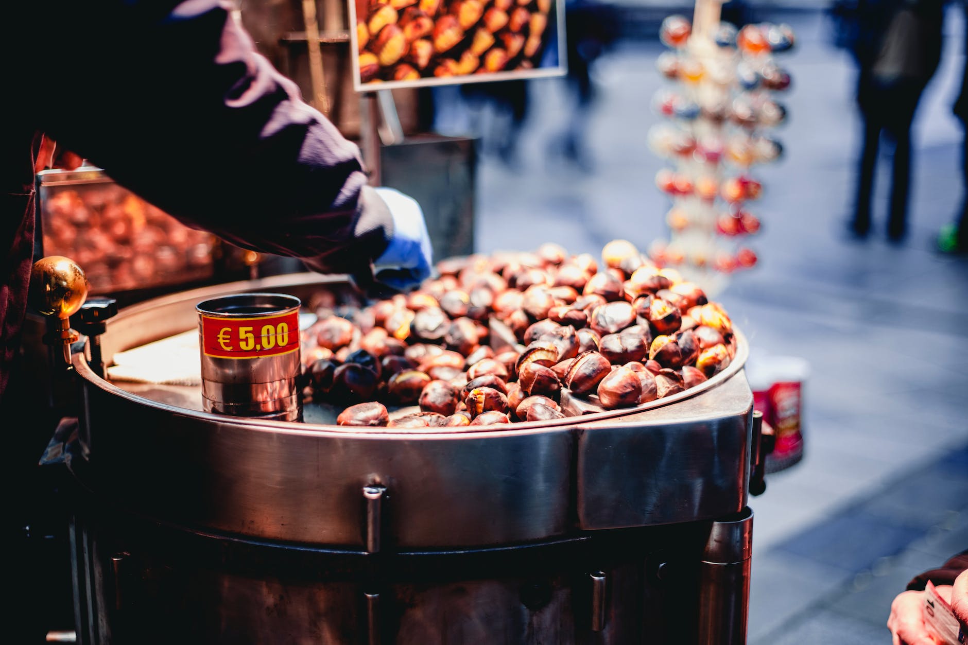 person selling chestnuts