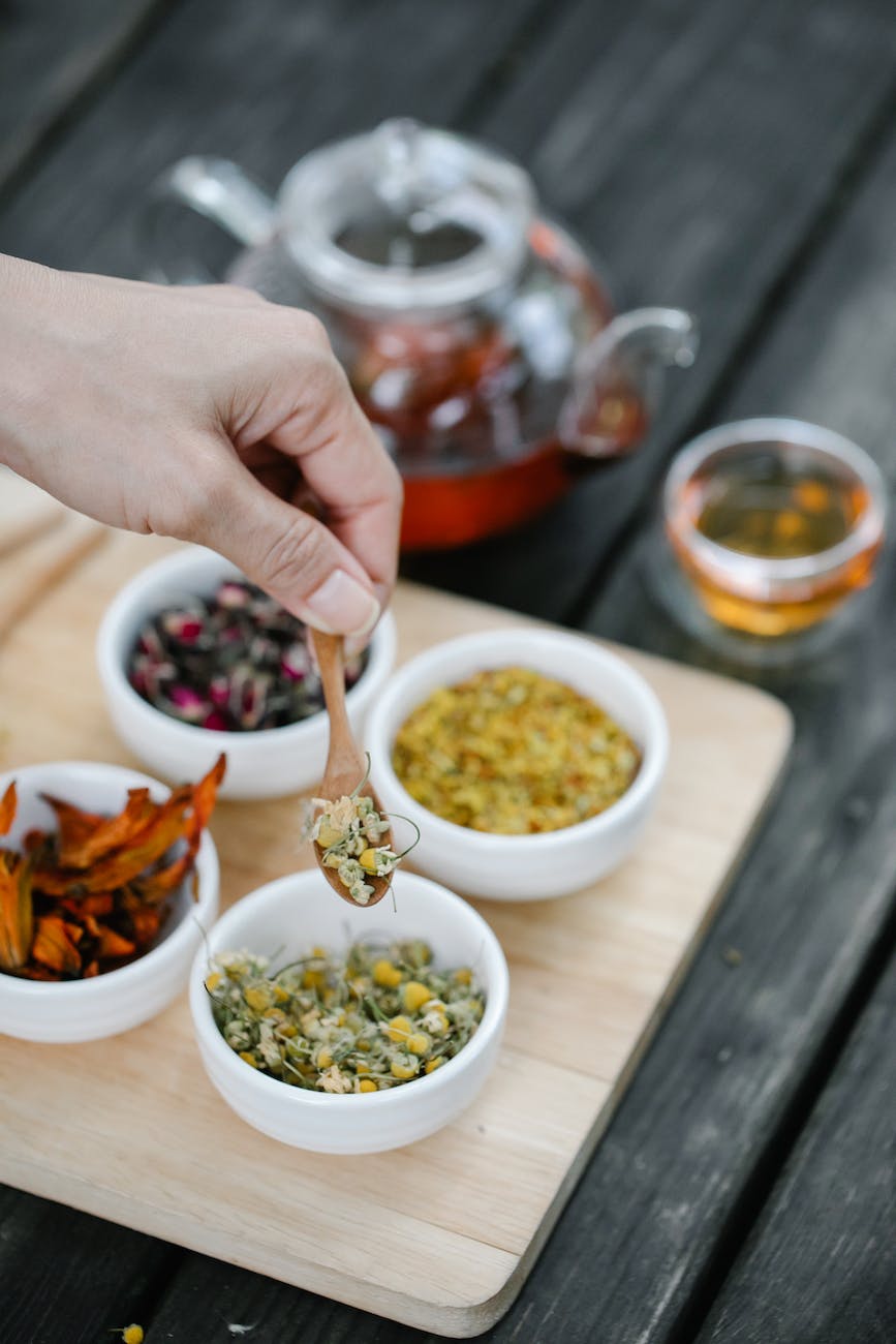 exotic tea ingredients in small ceramic bowls