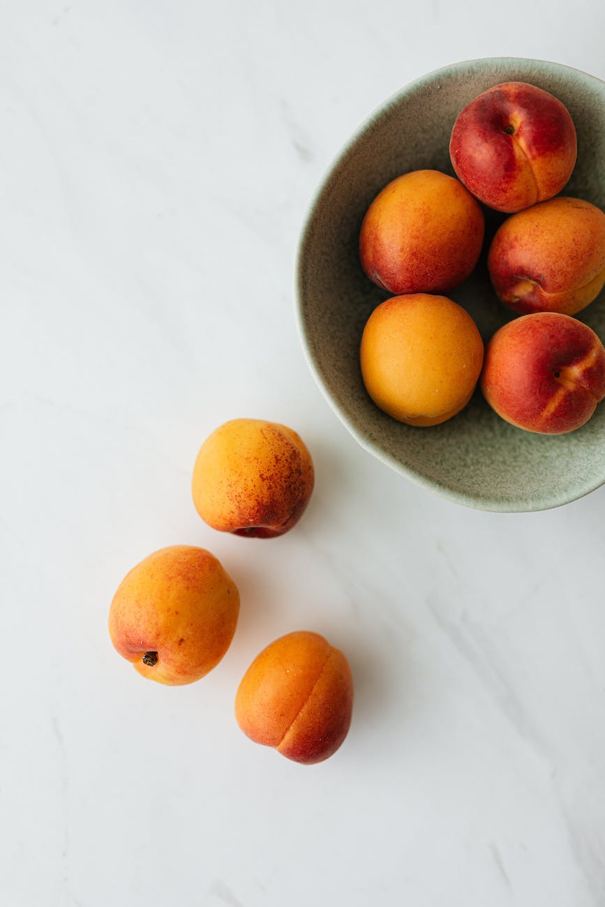 fresh ripe fruits in bowl on table